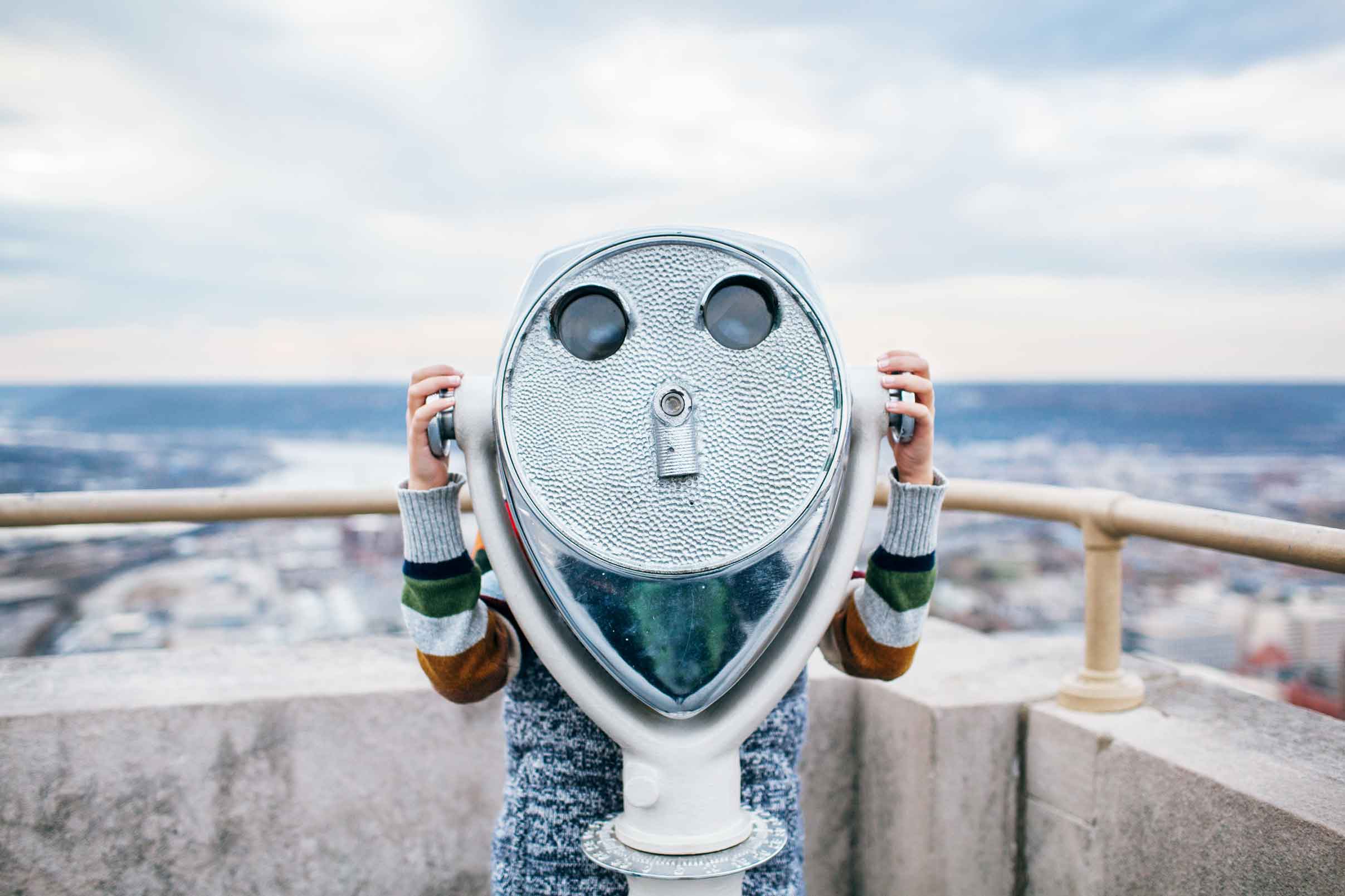 Telescope Someone on a rooftop looking through a telescope